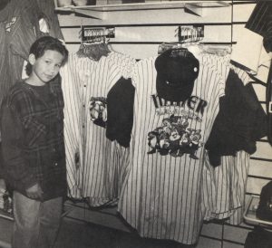 Jonathan Taylor Thomas inspects the Baseball shirt selection at the Disney souvenir store in Cleveland, Ohio.