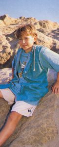 Jonathan Taylor Thomas climbing rocks